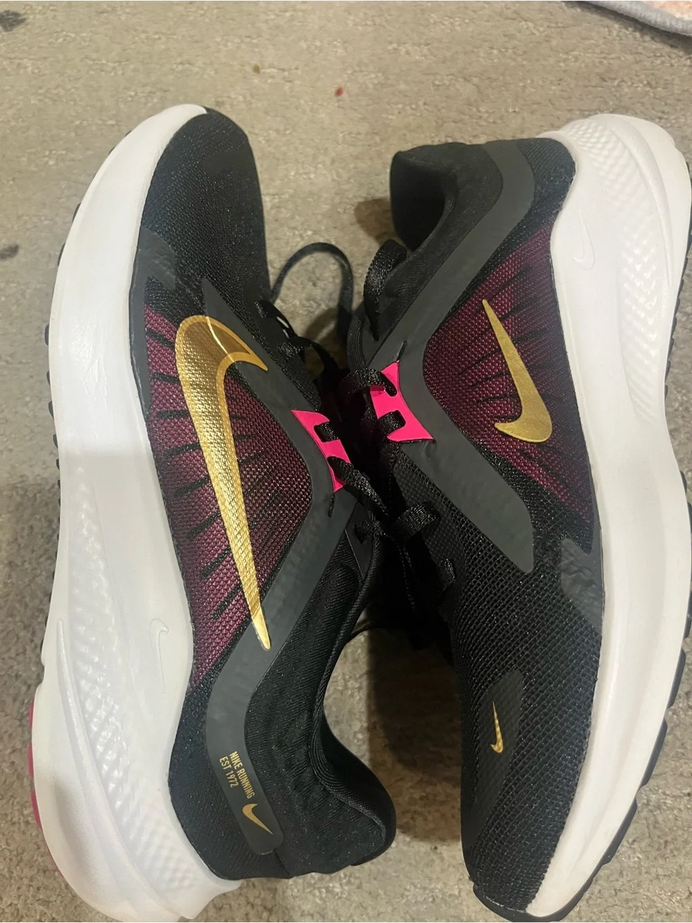 Nike Women’s Black/Purple Running Shoes with Gold Swoosh